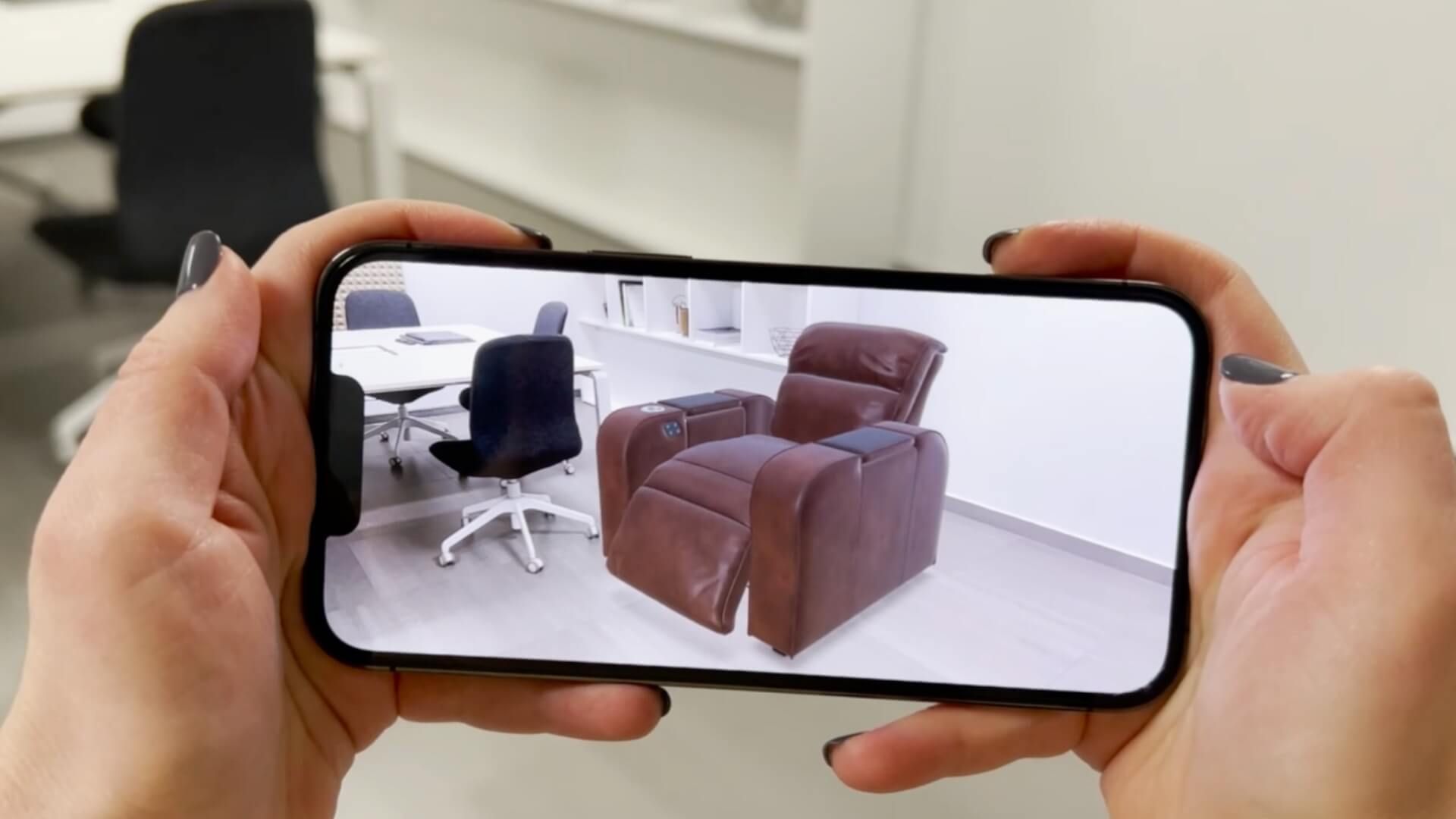 Augmented reality furniture preview showing a leather recliner placed in an office space via smartphone